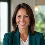 Dr. Evelyn Reed, Founder & CEO of Veridian Bloom, a woman in her late 40s with a warm, confident smile. She is dressed in smart casual attire, in a modern, light-filled office setting. Her posture is approachable yet authoritative.